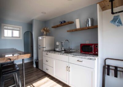 Kitchen area in Room 207 at Beachfront Inn