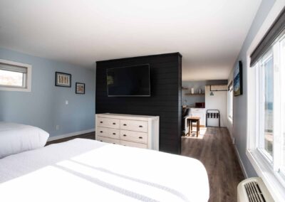 Bedroom area in Room 207 at Beachfront Inn